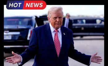 Donald Trump gestures with open arms at airport tarmac with