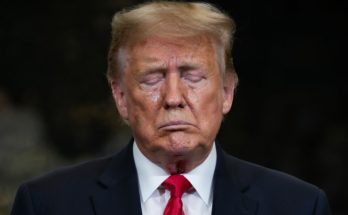 Donald Trump standing quietly in Washington D.C.