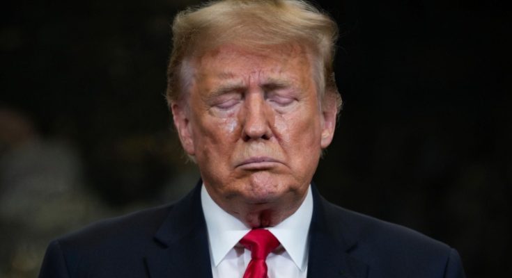 Donald Trump standing quietly in Washington D.C.