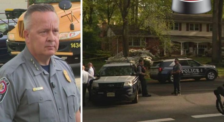 A police officer in uniform stands in front of a school bus, next to a photo of police