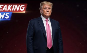 Donald Trump in a dark suit and pink tie against a dark red background with a 'BREAKING