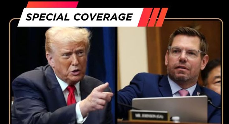 Two men in suits, one pointing forward, the other seated at a desk with a laptop