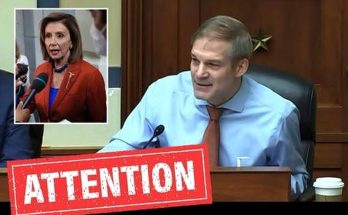 Jim Jordan seated at a desk with a microphone, wearing a light blue shirt and orange