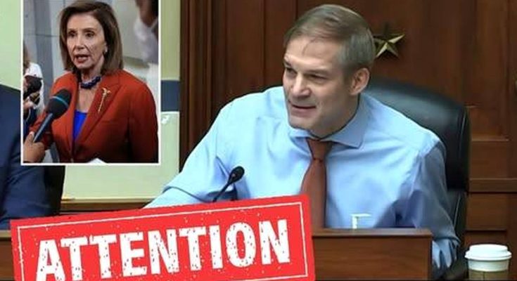 Jim Jordan seated at a desk with a microphone, wearing a light blue shirt and orange