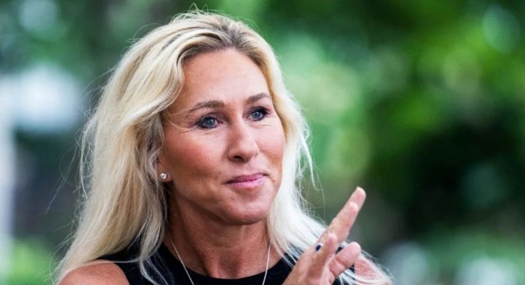 Marjorie Taylor Greene clapping outdoors with text overlay about election development