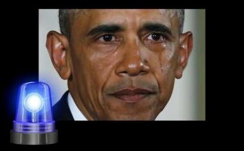 A close-up photograph of Barack Obama with tears visible on his face, positioned below