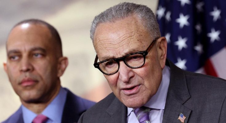 Chuck Schumer speaking at a podium with Hakeem Jeffries standing behind him, American