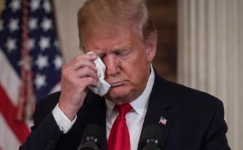Trump wipes tears at podium with American flag