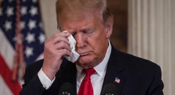 Trump wipes tears at podium with American flag