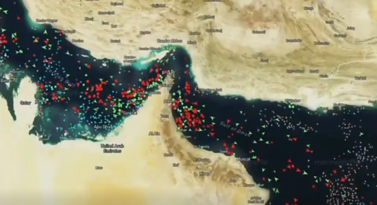 satellite map showing Persian Gulf and Strait of Hormuz with colored vessel tracking