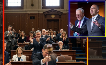 Man with headphones speaking into studio microphone