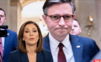 Newsreader reports breaking news with JD Vance on screen