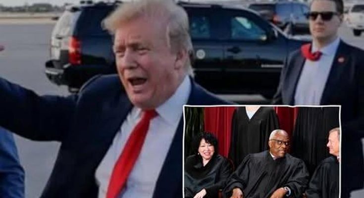 Donald Trump gesturing with his mouth open on an airport tarmac with black SUVs in the