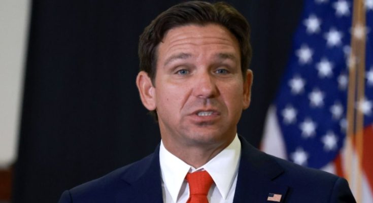 ron DeSantis speaking at podium with Florida seal and American flag behind him, text asks