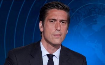 news anchor in studio with world map background