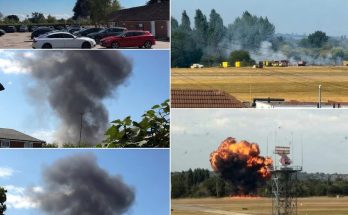 smoke and explosion at airfield with emergency response vehicles