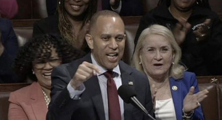 hakeem Jeffries speaks passionately at House podium with Democratic colleagues applauding