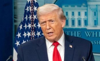 donald Trump speaks at White House podium beneath bold headline reading CAR CRASH Stuns