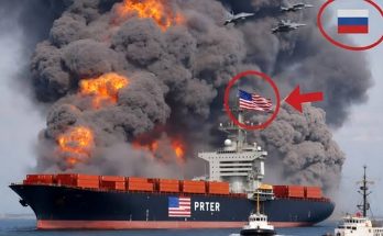 burning cargo ship with American flag, thick smoke billowing
