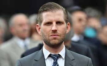 confident businessman in formal suit at public event