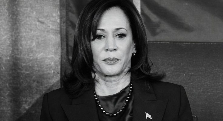 woman in formal attire with serious expression, indoors setting