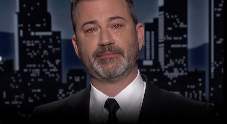 man in tears on TV show set with cityscape background