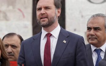 politician Vance with colleagues discussing Iran conflict