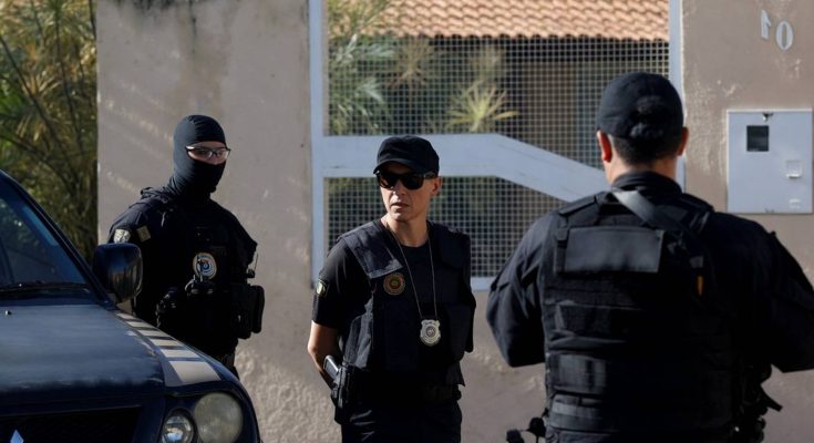 police officers in tactical gear outside residential building