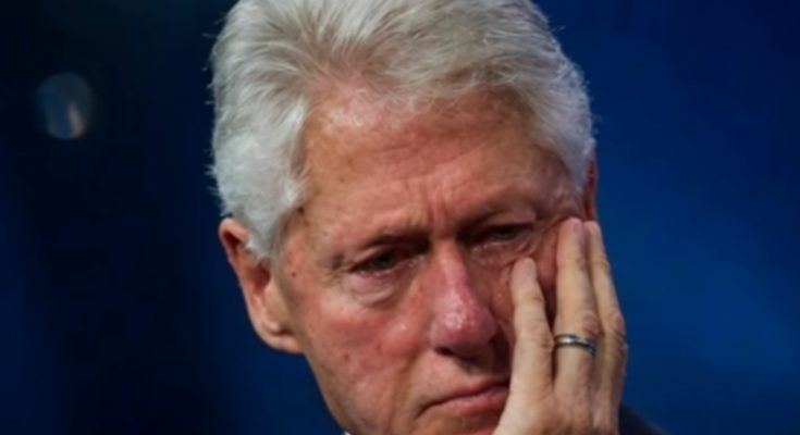 thoughtful man in suit with hand on face, deep in reflection