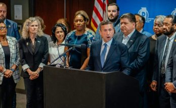 news figure speaking in a news photo