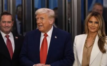 group of people in formal attire at a public event, focus on Donald Trump