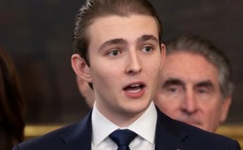news figure speaking in a news photo