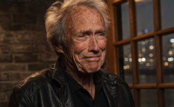 elderly man in leather jacket, thoughtful expression indoors