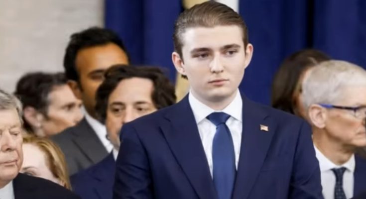 barron Trump in suit among officials, poised and composed
