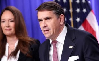 news figure speaking in a news photo
