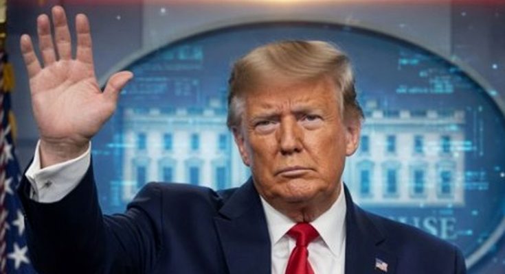 man in suit with raised hand in front of White House backdrop