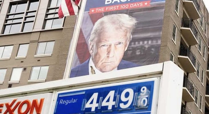 trump billboard above gas station with high prices displayed