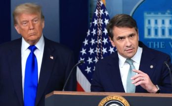 news figure speaking in a news photo
