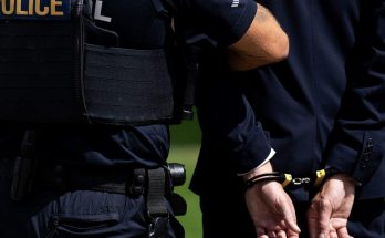 police arresting politician during election scandal