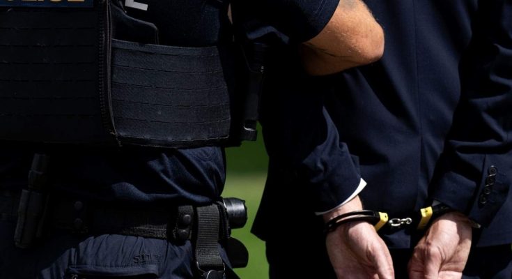 police arresting politician during election scandal
