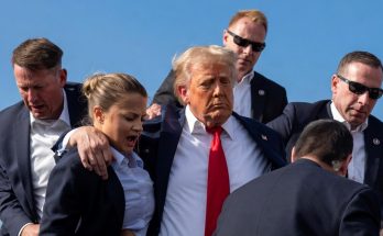 news figure speaking in a news photo