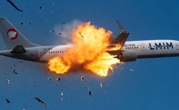 airplane mid-flight explosion with debris scattering in sky