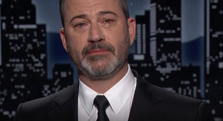 man in suit with tears in eyes against cityscape backdrop