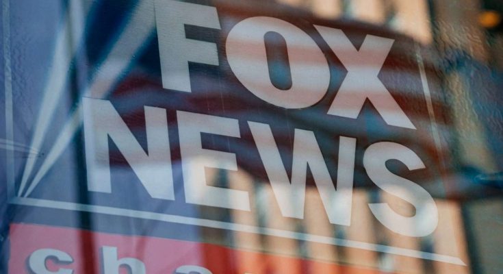 fox News logo reflection on city building window
