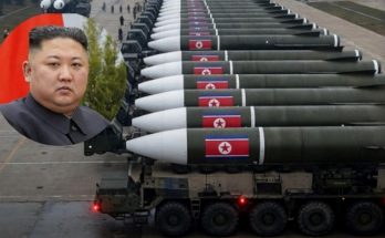 news figure speaking in a news photo