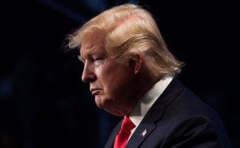 donald Trump in profile, displaying a contemplative expression