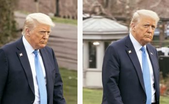 man in suit walking outside near White House lawn